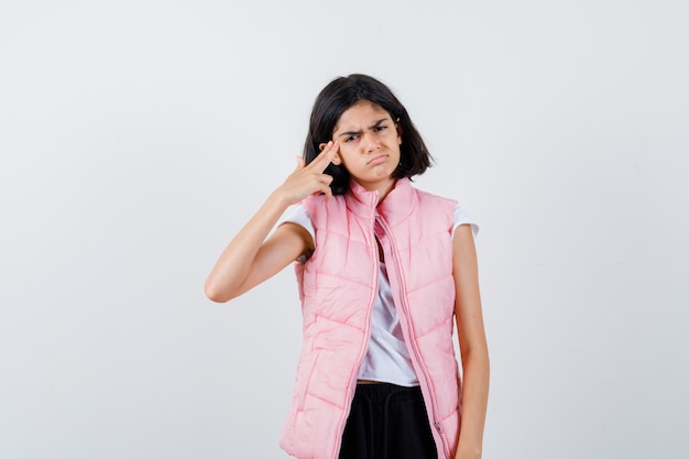 Portrait of a little girl in white t-shirt and puffer vest