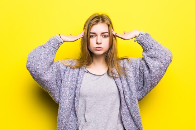 Portrait of a lovely teenage girl thinkinh isolated