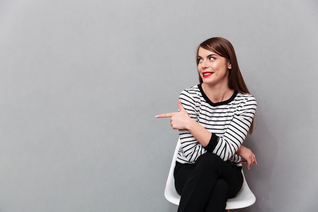 Portrait of a lovely woman sitting on chair