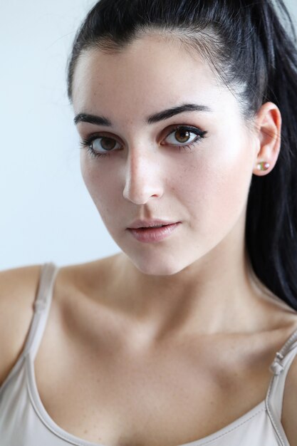 Portrait of lovely young woman posing