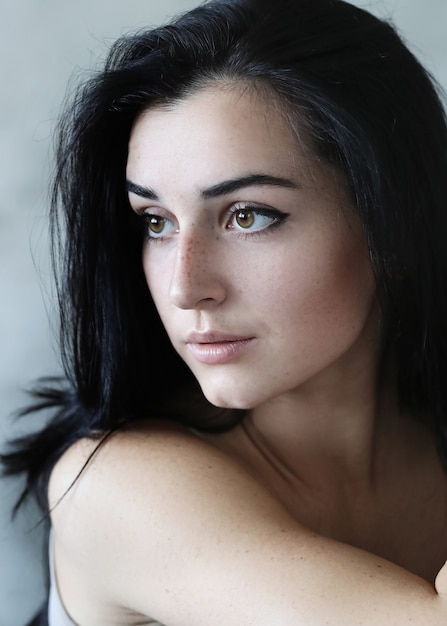 Portrait of lovely young woman posing