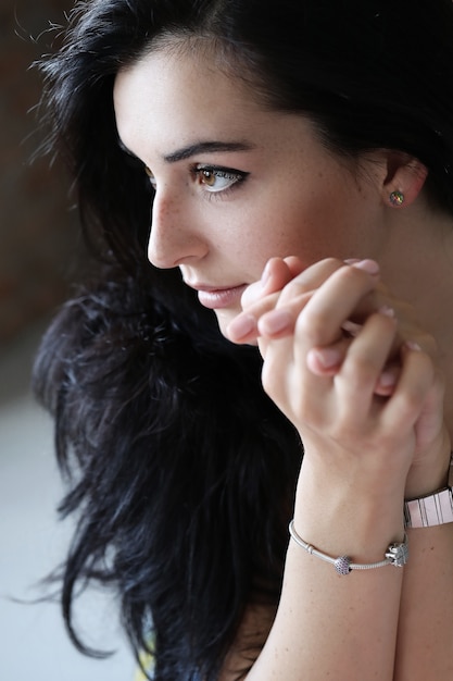 Portrait of lovely young woman posing