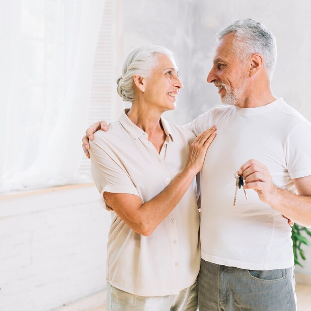 Portrait of loving senior couple at new house