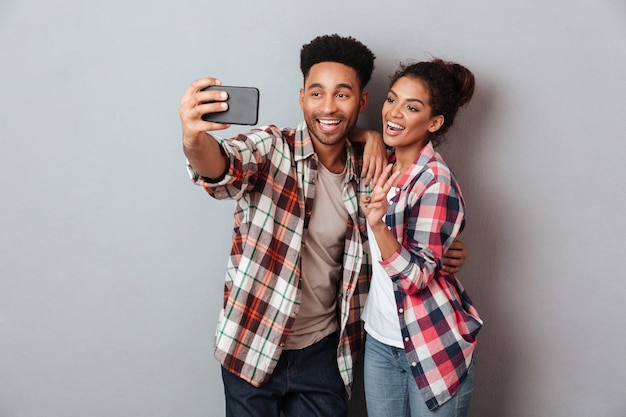 Portrait of a loving young african couple hugging