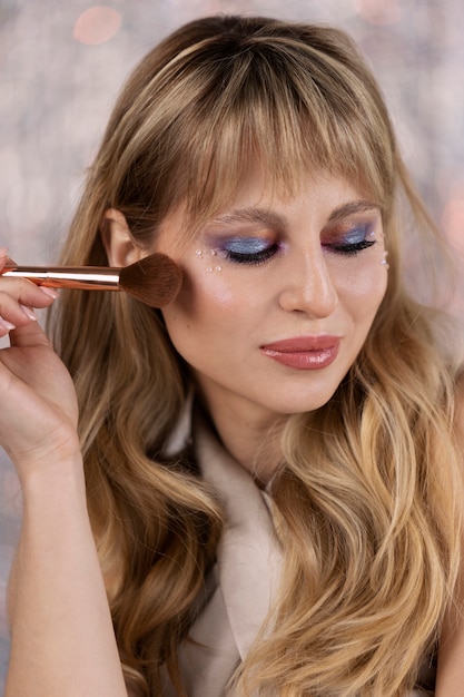 Portrait of makeup artist applying products