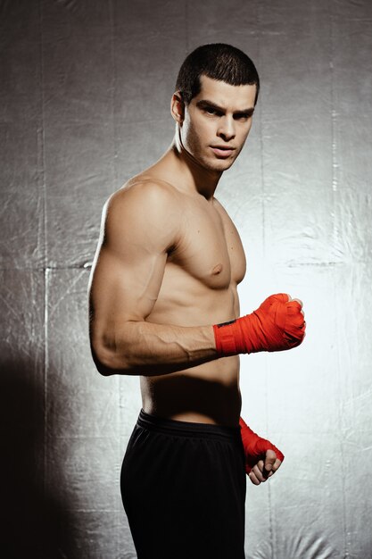 Portrait of male boxer posing