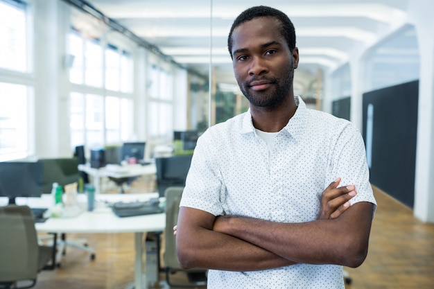 Portrait of male business executive with arms crossed