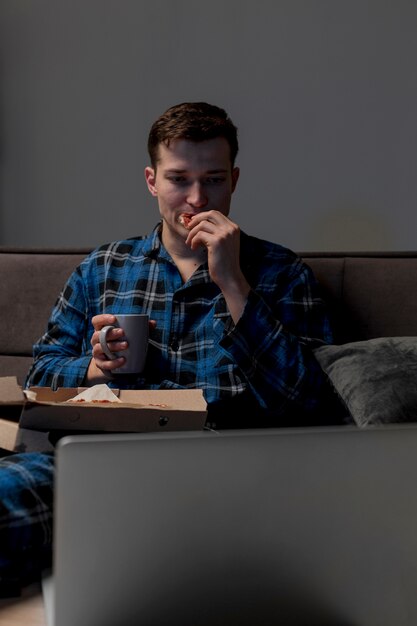 Portrait of male having a snack at home