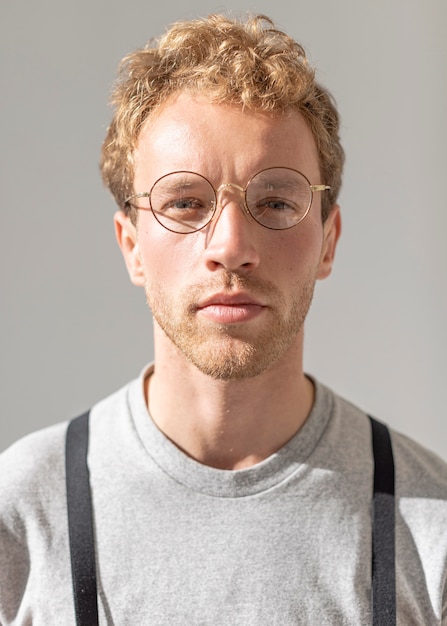 Portrait of male model wearing reading glasses