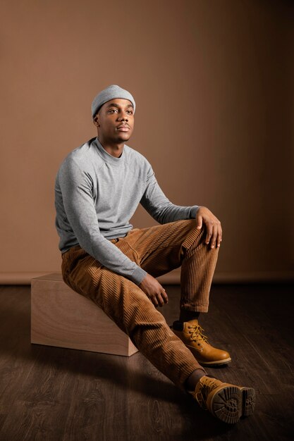 Portrait male wearing cap sitting