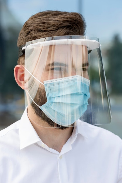 Free photo portrait male wearing mask