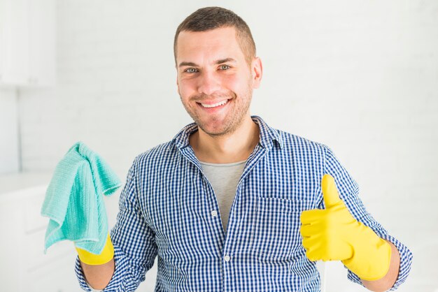 Portrait of man cleaning his house