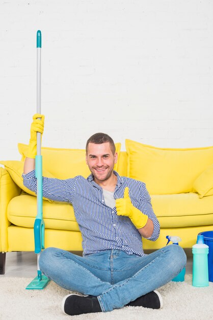 Portrait of man cleaning his house