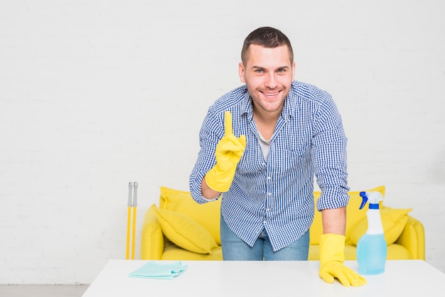 Portrait of man cleaning his house