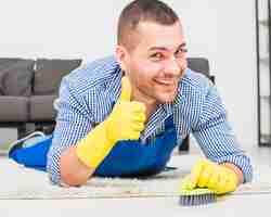 Free photo portrait of man cleaning his house