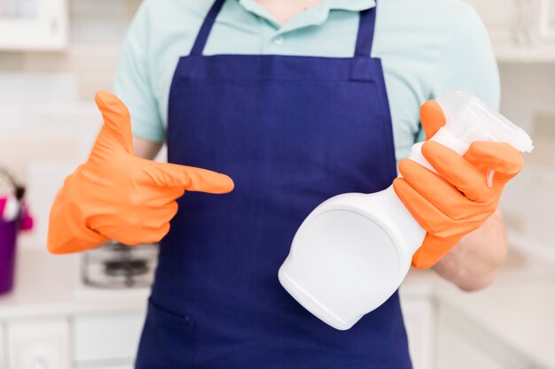 Portrait of man cleaning his house