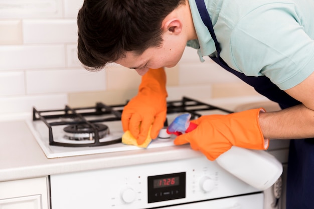 Portrait of man cleaning his house