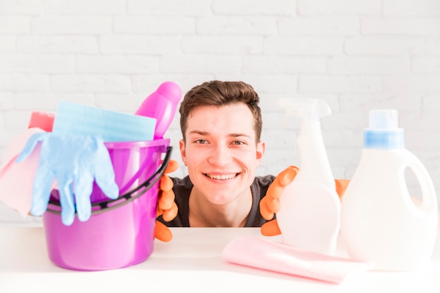 Portrait of man cleaning his house