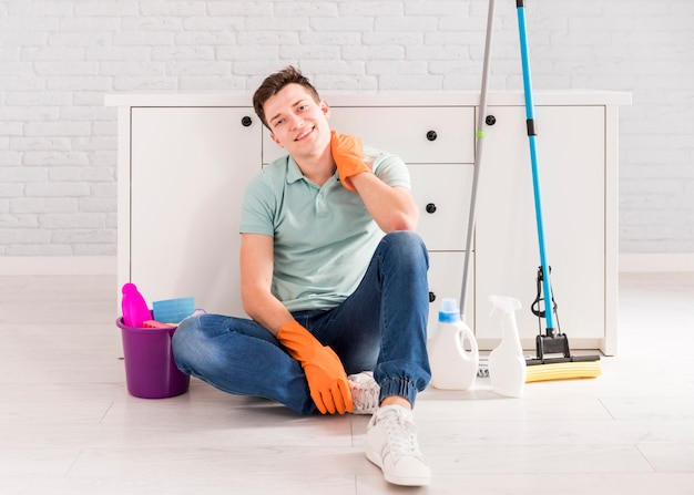 Portrait of man cleaning his house