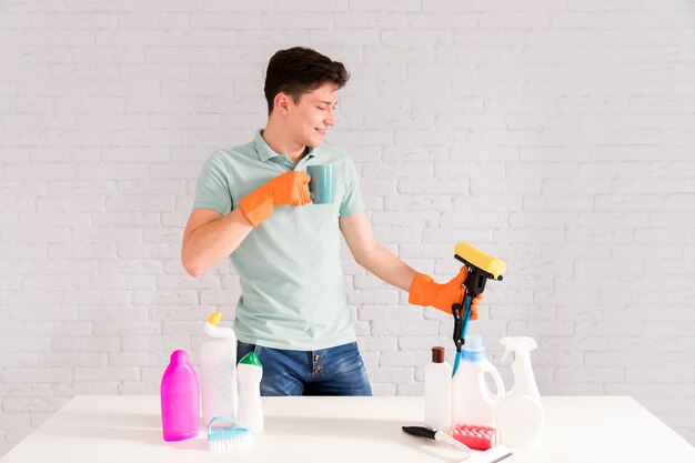 Portrait of man cleaning his house