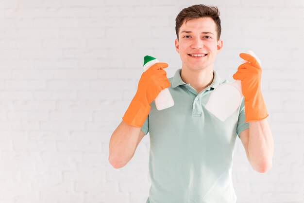 Portrait of man cleaning his house