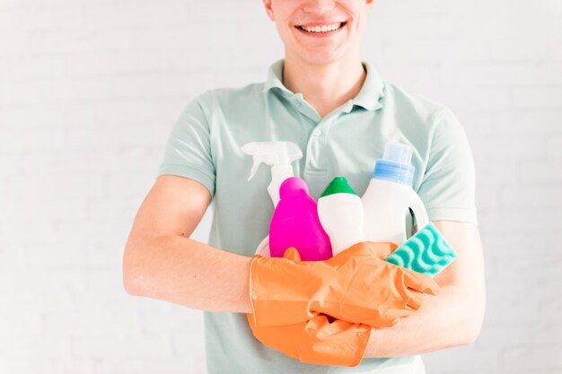 Portrait of man cleaning his house