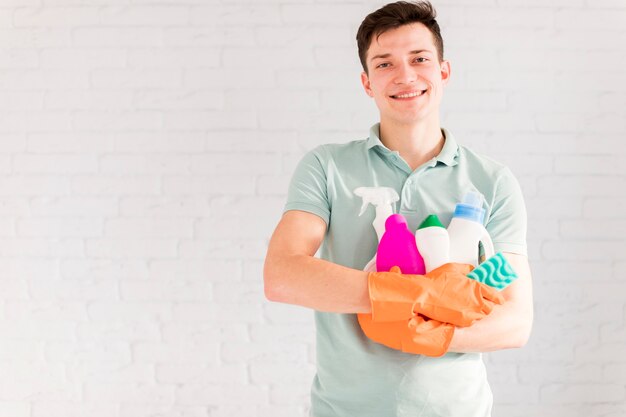 Portrait of man cleaning his house