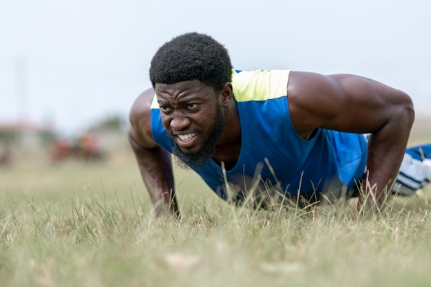 Free photo portrait man doing push ups