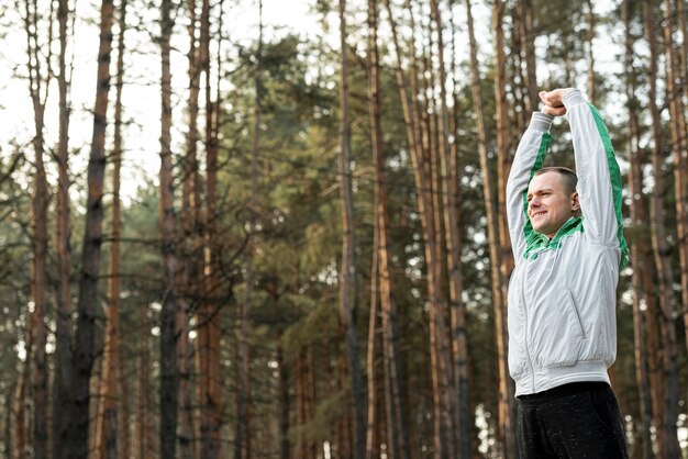 Portrait of man doing sport outside with copy space