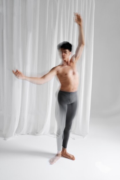 Portrait of man expressing body language through movement