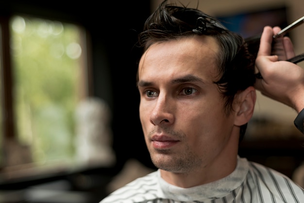 Portrait of a man getting a haircut