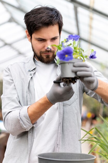 Portrait man growing plants