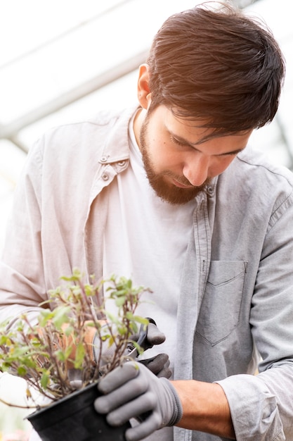 Free photo portrait man growing plants