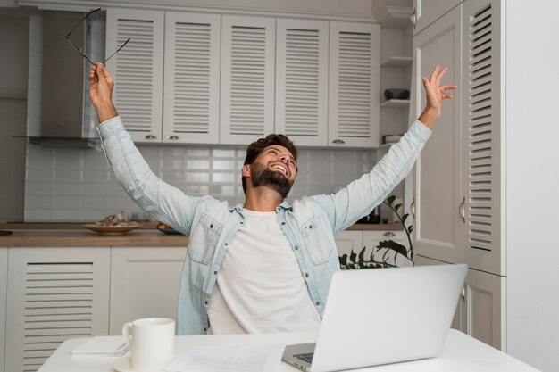 Portrait of man happy for finishing work assignment