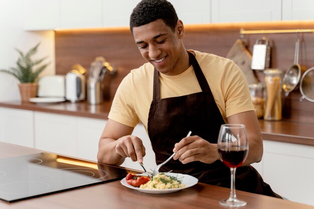 Portrait man at home eating