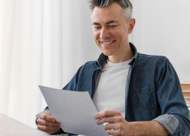 Portrait man reading letter