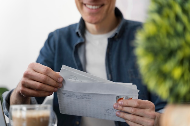 Portrait man reading letters