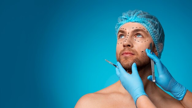 Portrait of man receiving enhancements and tweakments through the help of cosmetic procedures