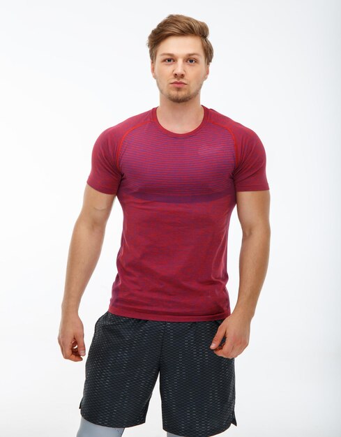 Portrait of a man in sportswear isolated on a white background.