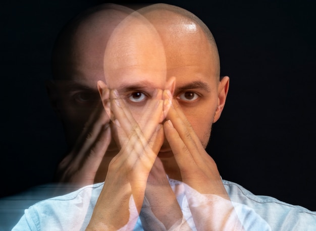 Portrait of man suffering from schizophrenia