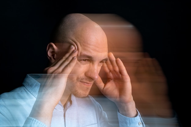 Free photo portrait of man suffering from schizophrenia