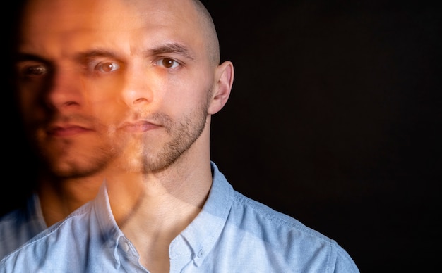 Free photo portrait of man suffering from schizophrenia