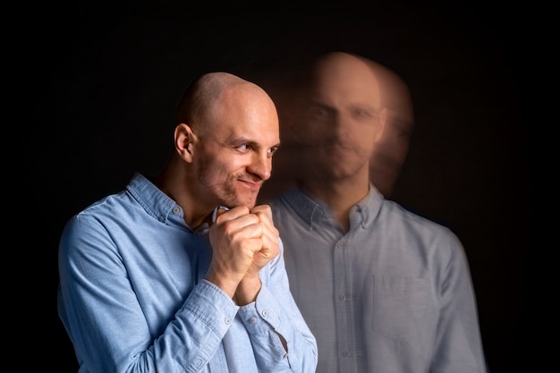 Free photo portrait of man suffering from schizophrenia