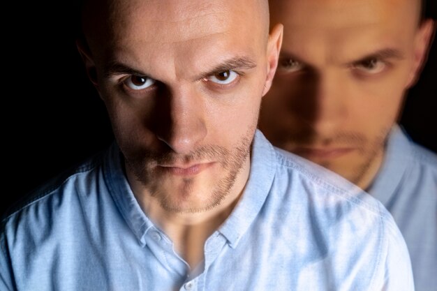 Portrait of man suffering from schizophrenia