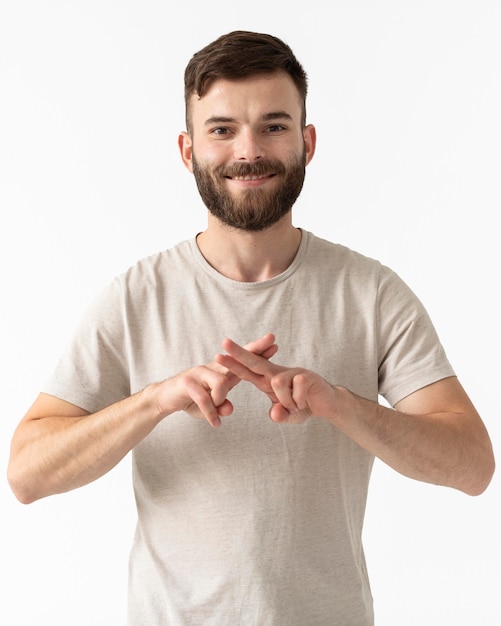 Portrait of man teaching sign language