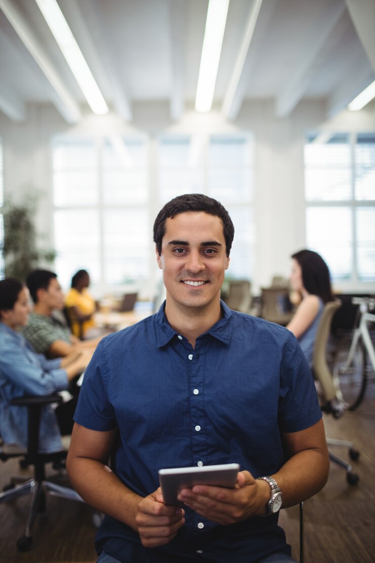 Free Photo portrait of man using digital tablet