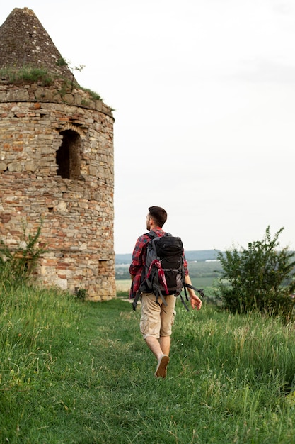 Portrait man visiting castle