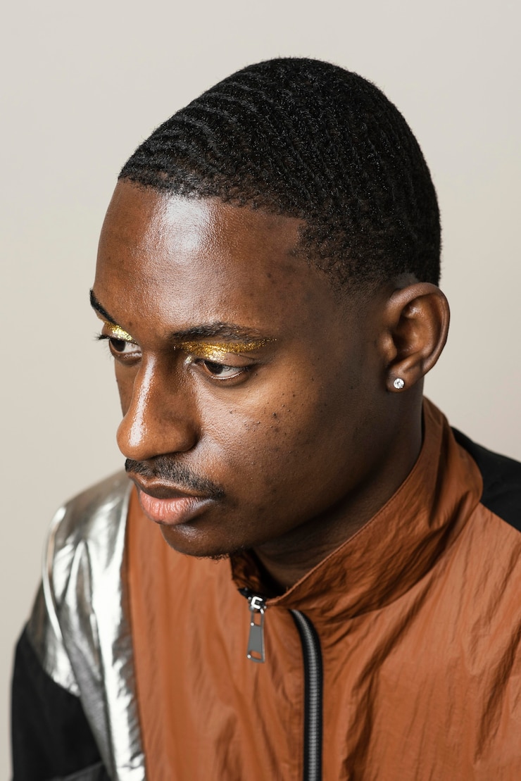 Free Photo portrait of man wearing eye shadow