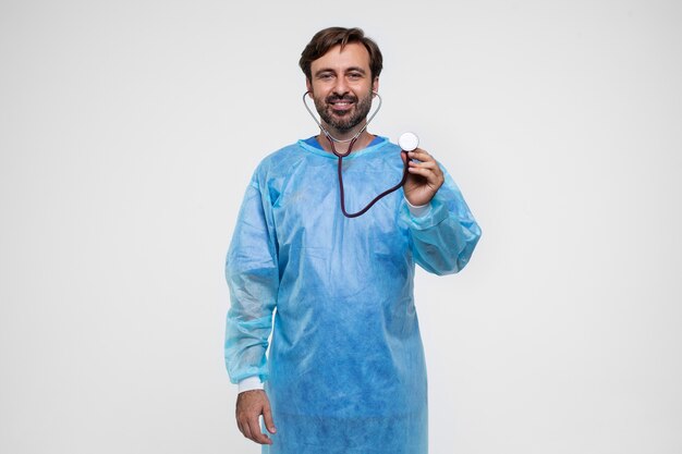 Portrait of man wearing medical gown and stethoscope