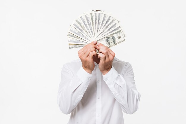 Portrait of a man in white shirt hiding